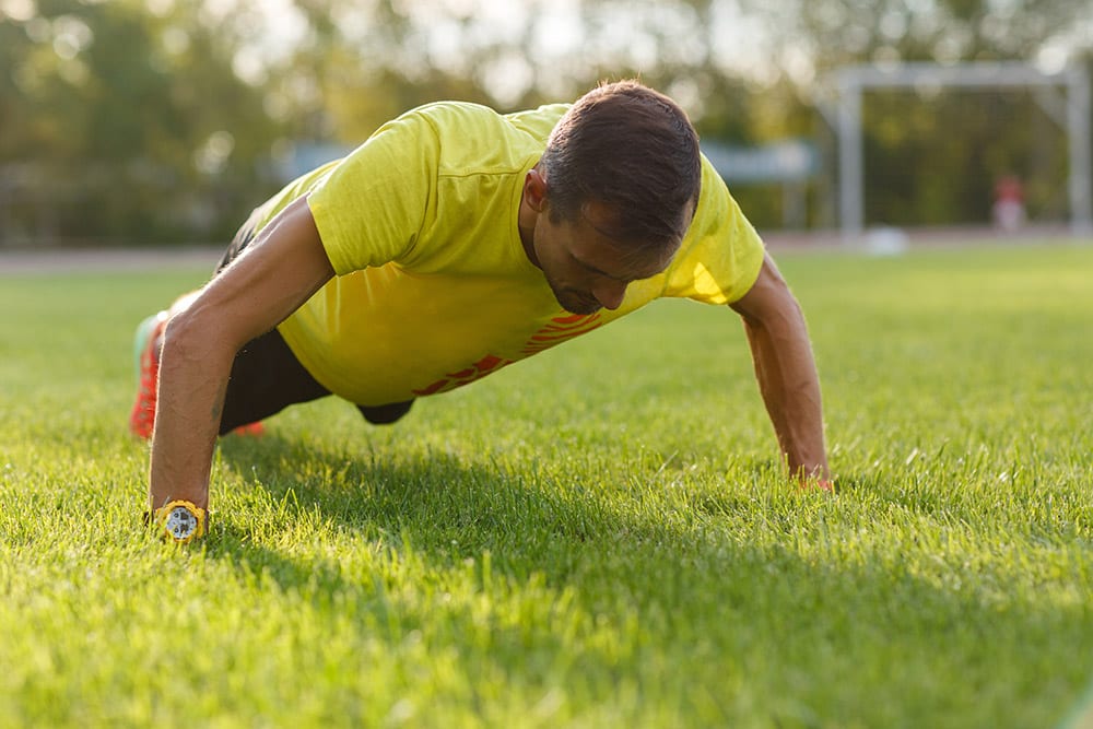 Doing pushups in the grass